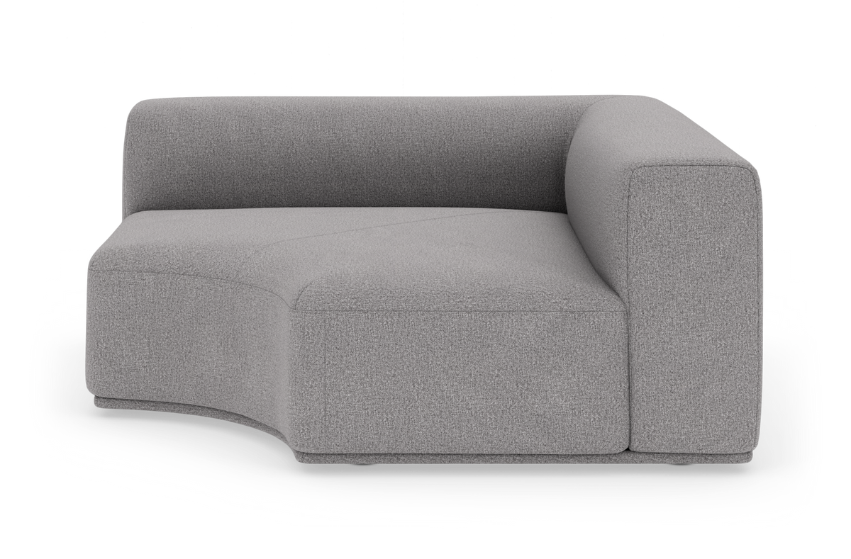 Grå hjørnemodul til sofa med blødt buet sæde i stof på hvid baggrund.