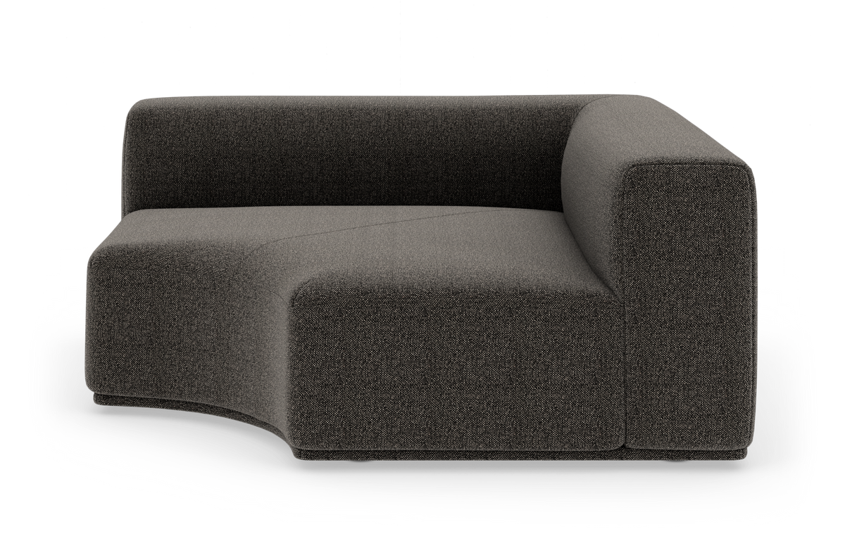 Mørkegrå modulsofa med afrundet sæde, vist i studie på hvid baggrund.