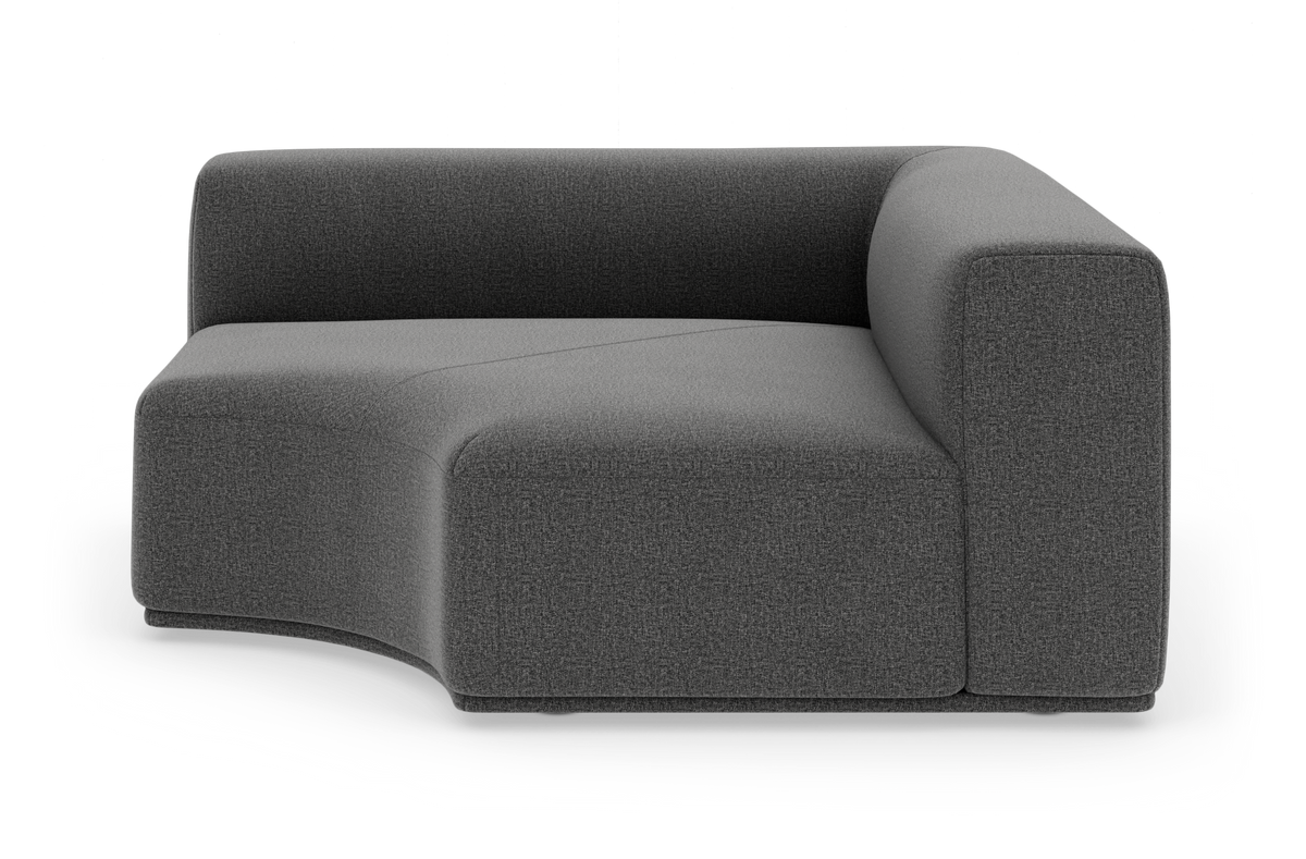 Mørkegrå modulsofa med buet sæde og høj armlæn, frilagt på hvid baggrund.