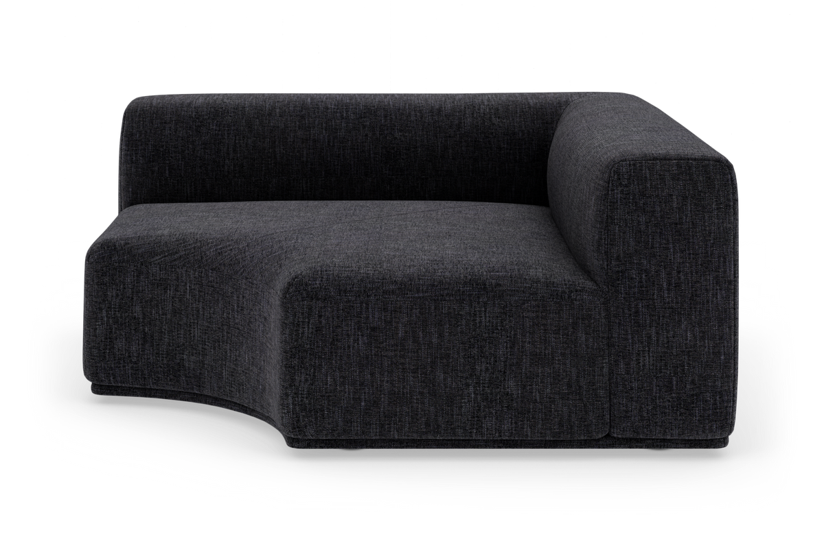 Mørkegrå modulsofa med højre armlæn og blødt buet sæde/front, frilagt på hvid baggrund.