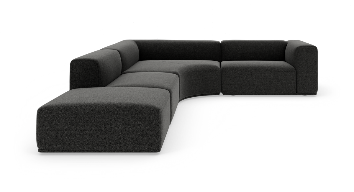 Modulær mørkegrå hjørnesofa i U‑form med bløde, afrundede moduler på hvid baggrund.