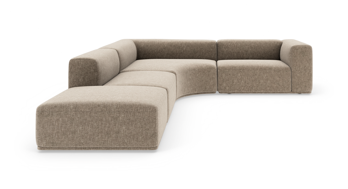 Modulær U‑formet hjørnesofa i beige stof med afrundede former, frilagt på hvid baggrund.