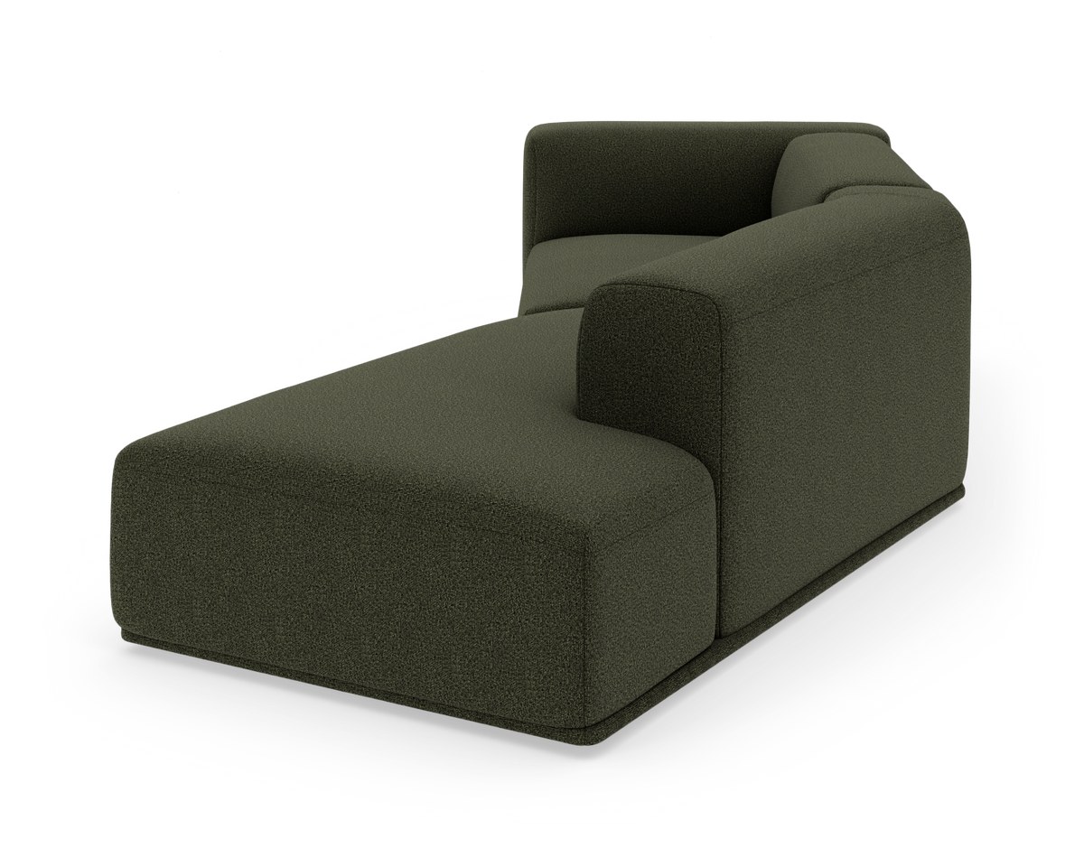 Mørkegrøn modulsofa/chaise longue med blødt afrundede former i boucléstof, fritlagt på hvid baggrund.