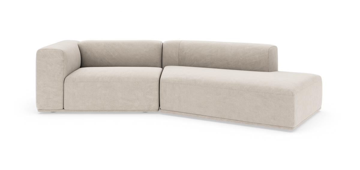 Beige modulsofa med venstrehjørne og chaiselong, frilagt på hvid baggrund.