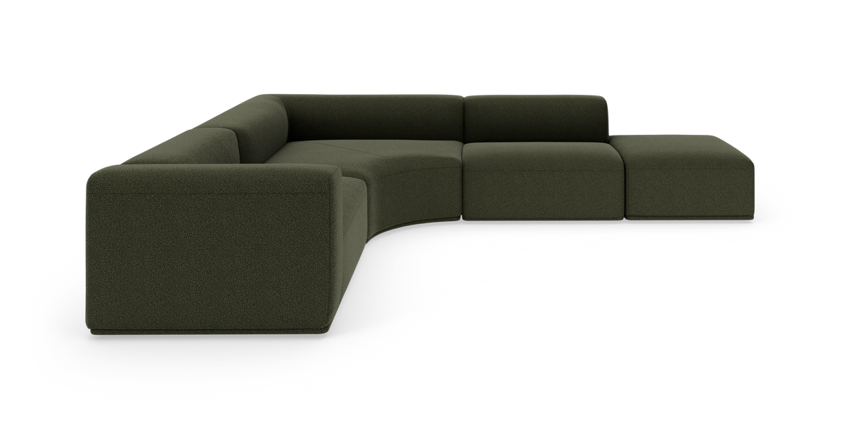 Modulsofa i mørkegrønt stof med buet hjørne, L‑formet, moderne design på hvid baggrund.