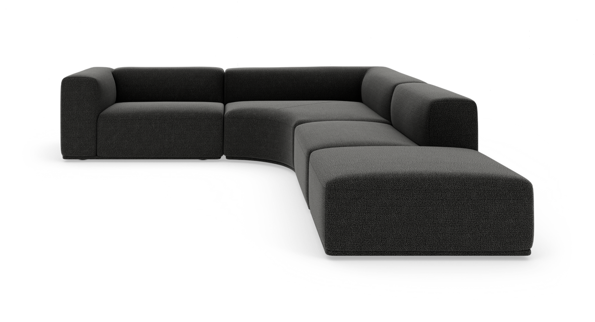 Mørkegrå modulær hjørnesofa med buet sektion, frilagt på hvid baggrund.