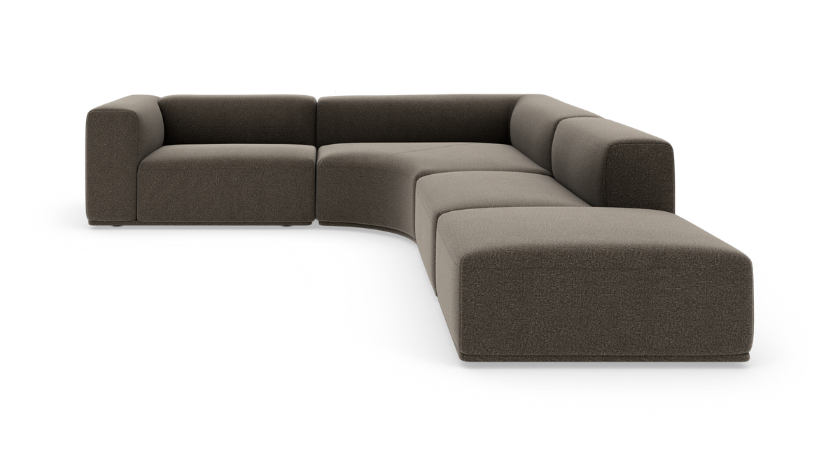 Modulær L‑formet sofa i mørkegrå/brun tekstil på hvid baggrund.