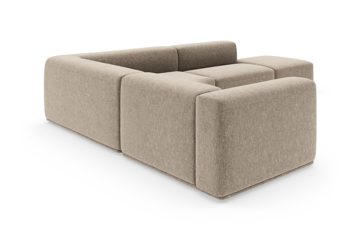 Beige modulsofa i U‑form med brede, afrundede armlæn, fritlagt på hvid baggrund.