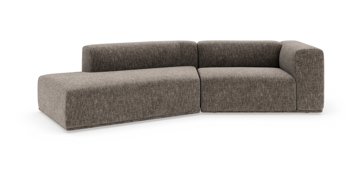Modulær L‑sofa i gråmeleret stof med afrundede hjørner, fritlagt på hvid baggrund.