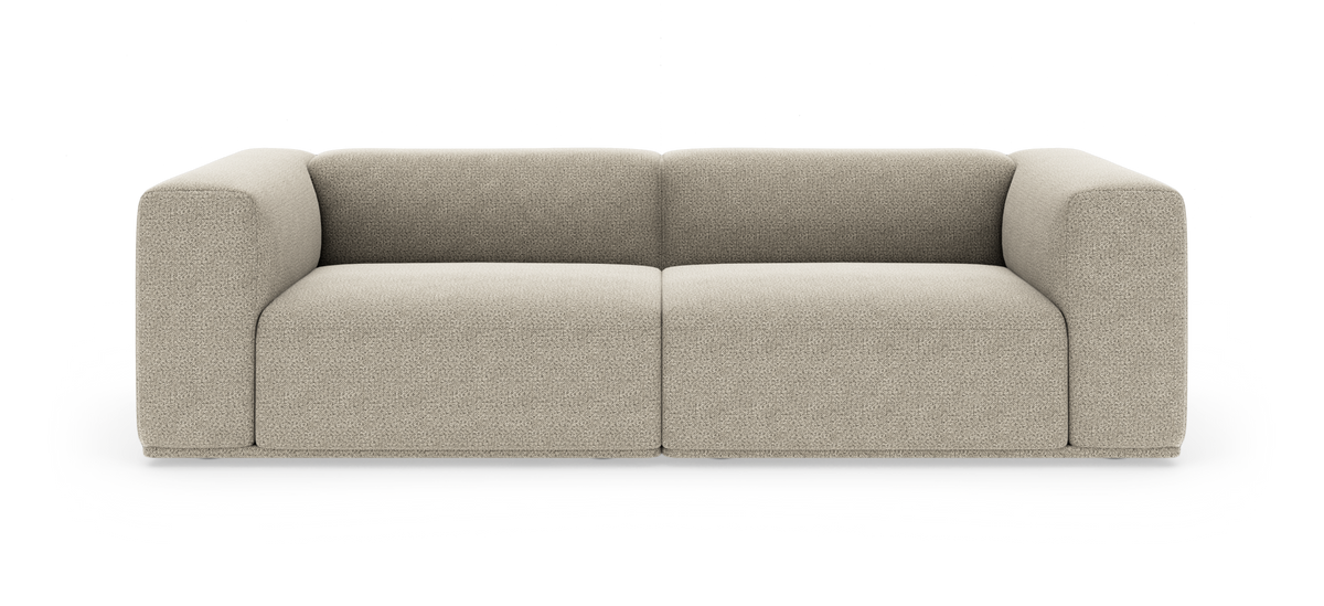 Beige modulsofa i bouclé med brede armlæn, frontvisning på hvid studiebaggrund.