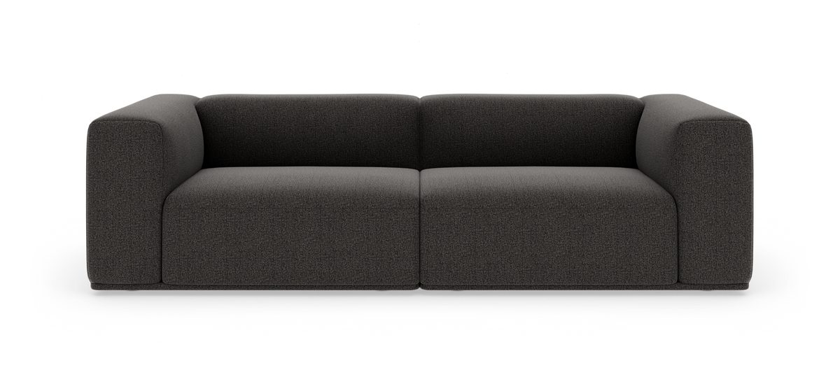 Mørkegrå, moderne 2-personers sofa med brede, afrundede armlæn, frilagt på hvid baggrund.