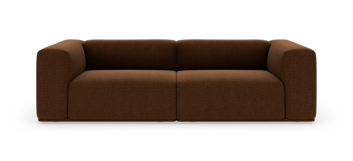 Brun, moderne modulsofa med bløde, afrundede armlæn, fritlagt på hvid baggrund i frontvisning.