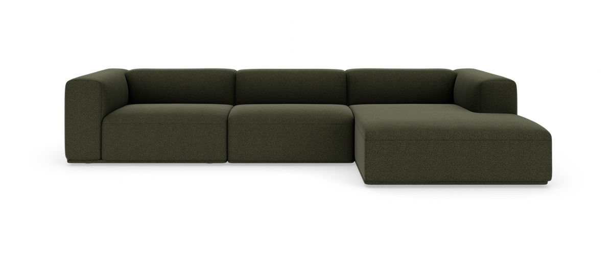 Mørkegrøn modulsofa med chaiselong i højre side, frilagt på hvid baggrund.