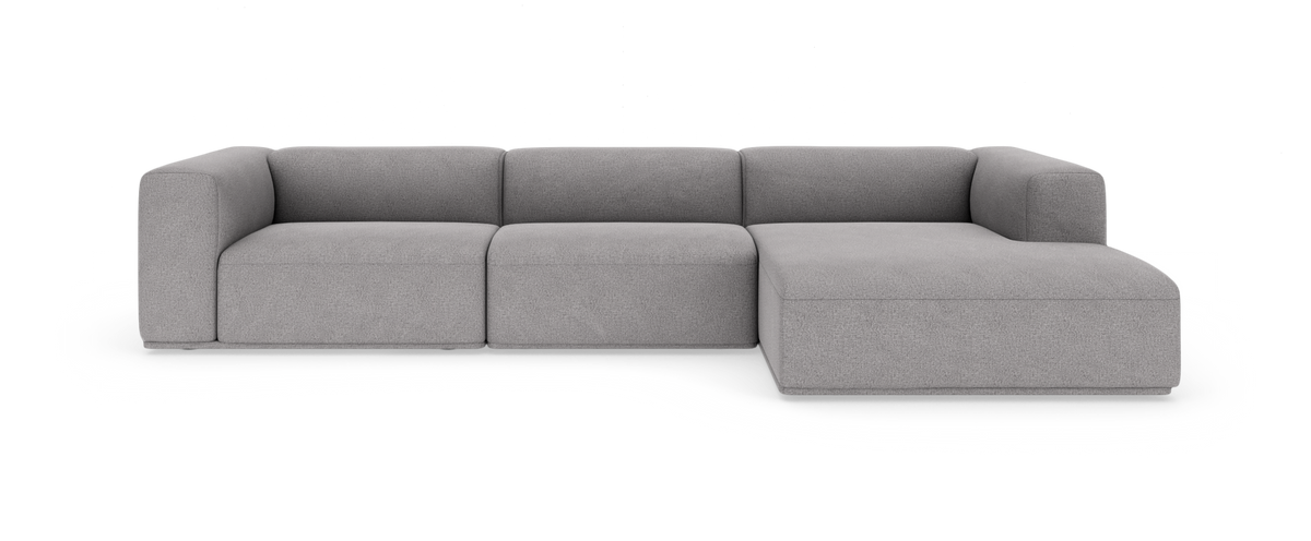 Grå modulsofa med chaiselong til højre, frilagt på hvid baggrund.