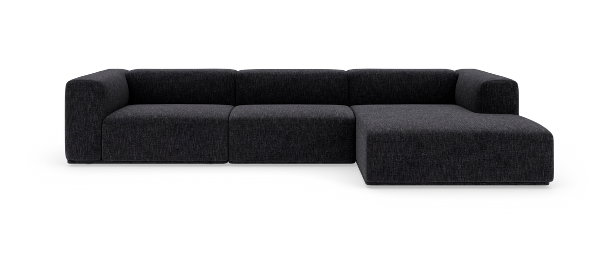 Mørkegrå modulsofa med chaiselong på højre side, set forfra på hvid baggrund.