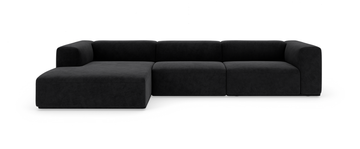 Sort modulsofa med venstrevendt chaiselong, fritstående på hvid baggrund.
