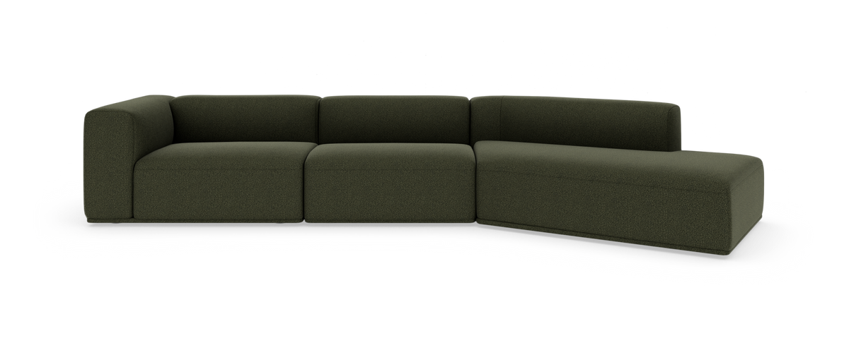 Mørkegrøn modulsofa med chaiselong til højre, frilagt på hvid baggrund.