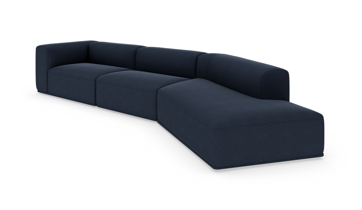 Mørkeblå modulopbygget hjørnesofa med afrundede armlæn og chaiselong, frilagt på hvid baggrund.