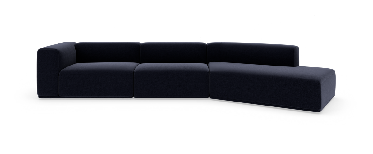 Modulsofa i mørkeblåt stof med højre chaiselong, frilagt på hvid baggrund.