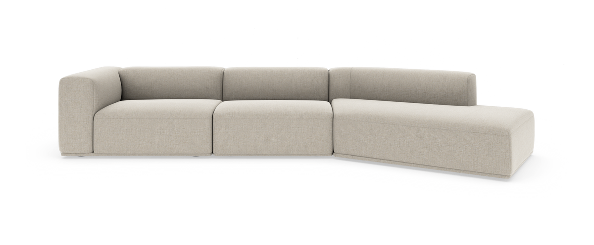 Beige modulsofa med højrevendt chaiselong, tre siddepladser og hjørnemodul i studieopsætning.