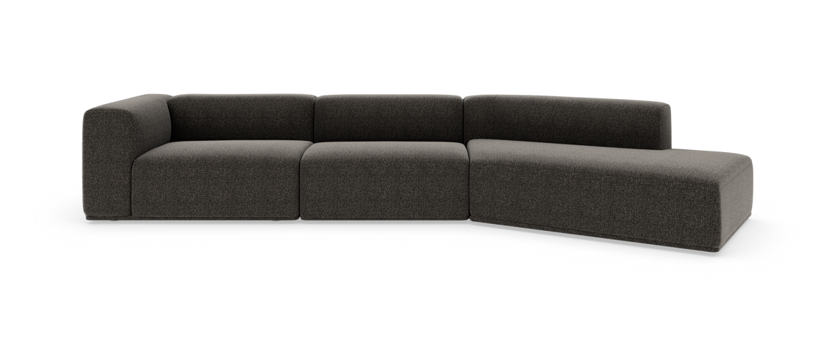 Mørkegrå modulsofa i L-form på hvid baggrund.