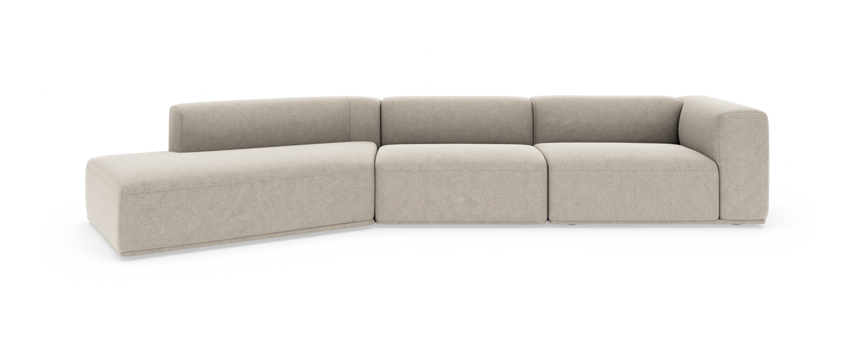 Modulsofa i beige stof med venstrevendt chaiselong og bløde, moderne former.