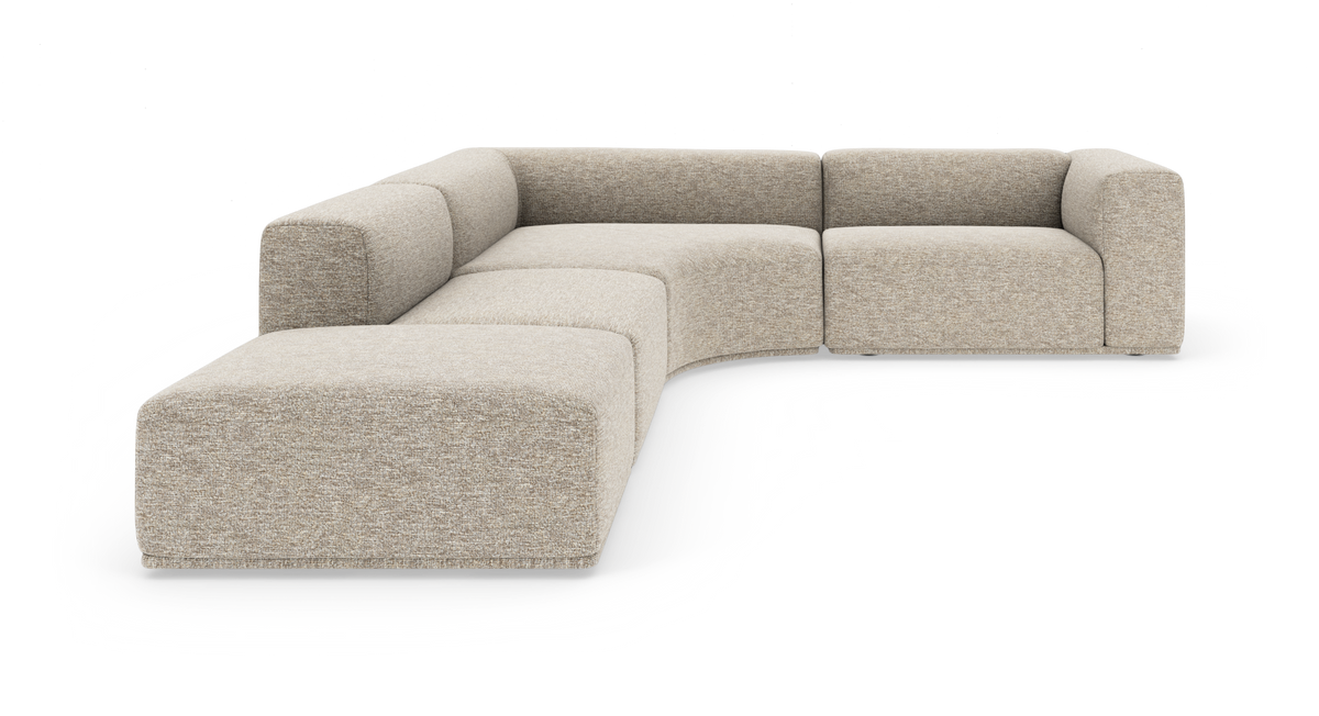 Modulær, blødt buet beige hjørnesofa i stof på hvid baggrund.