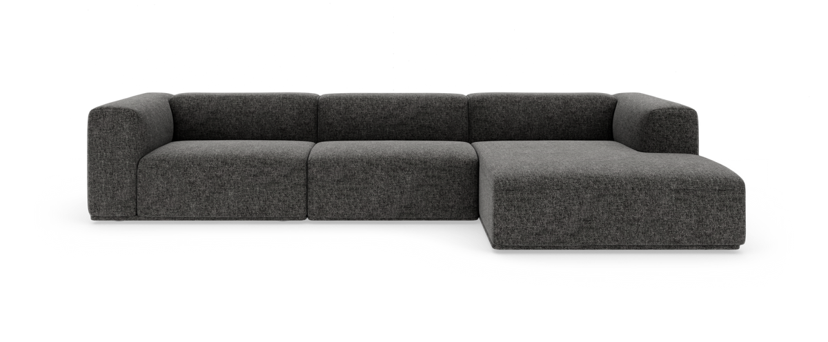 Mørkegrå modulsofa med højre chaiselong på hvid baggrund.
