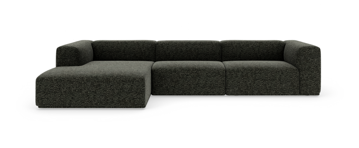Mørkegrå modulsofa med venstrevendt chaiselong, vist forfra på hvid studiebaggrund.