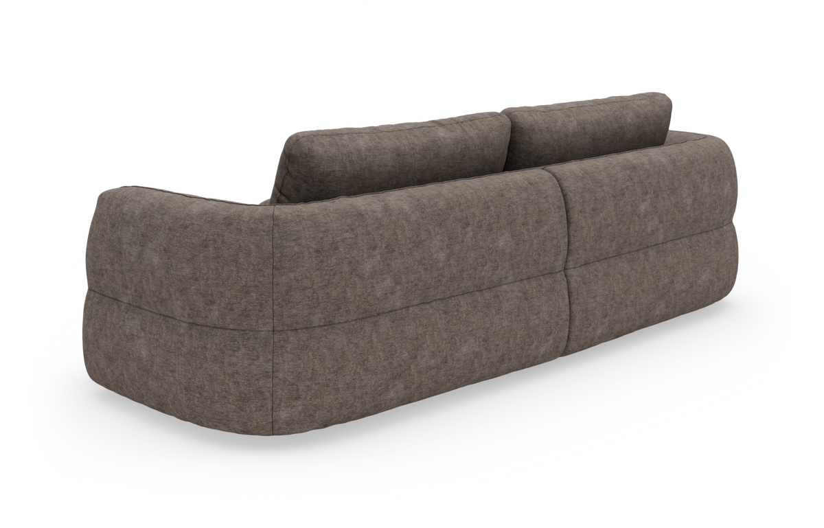 Brungrå modulsofa set skråt bagfra på hvid baggrund med bløde, afrundede former og tyk polstring.