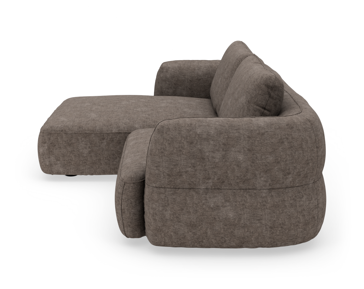Brungrå modulsofa med afrundede former og venstrevendt chaiselong, set fra siden.